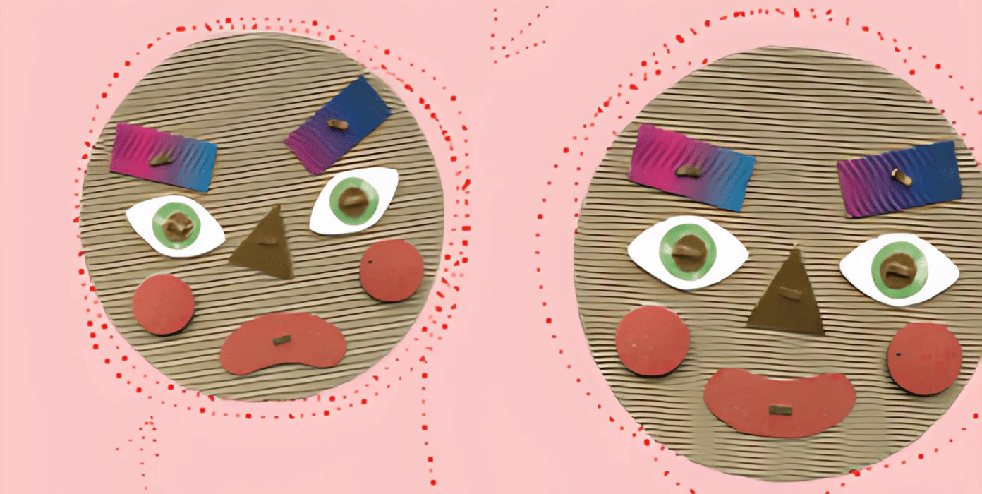 ein aus Pappe gebasteltes Gesicht, das untershciedliche Emotionen zeigt.